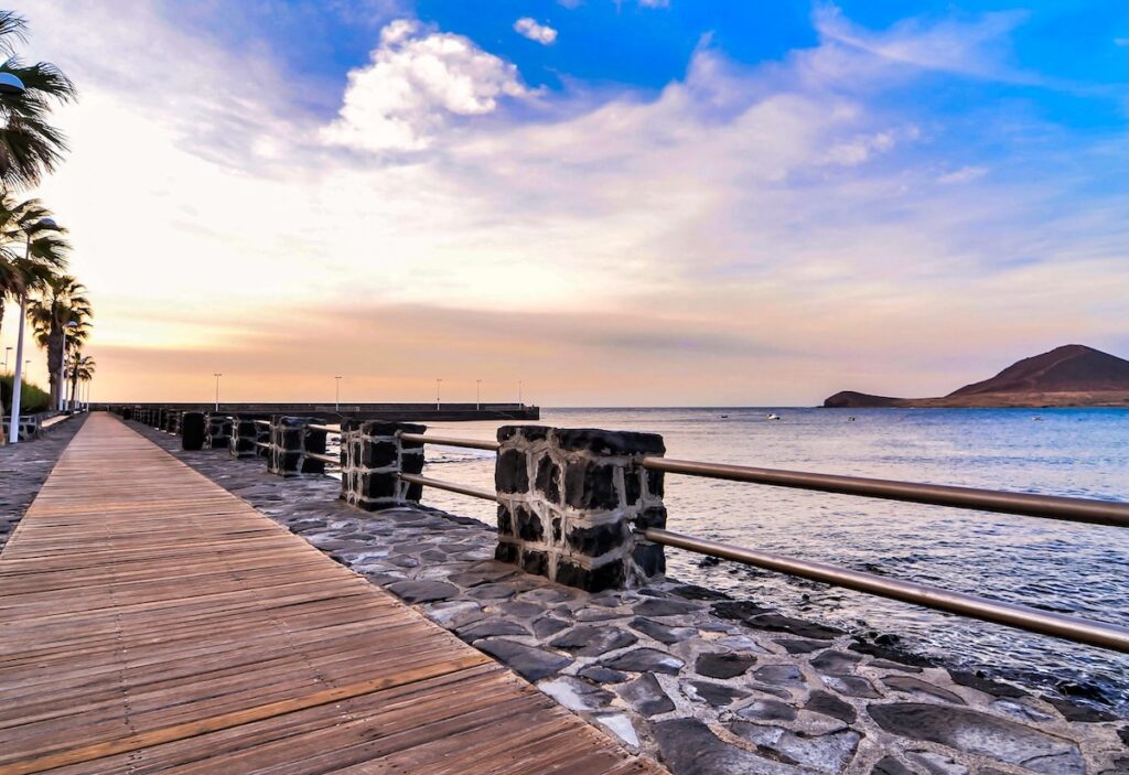 A boardwalk by the sea under a Lorem ipsum dolor sit amet, consectetur adipiscing elit, sed do eiusmod tempor incididunt ut labore et dolore magna aliqua. Ut en
